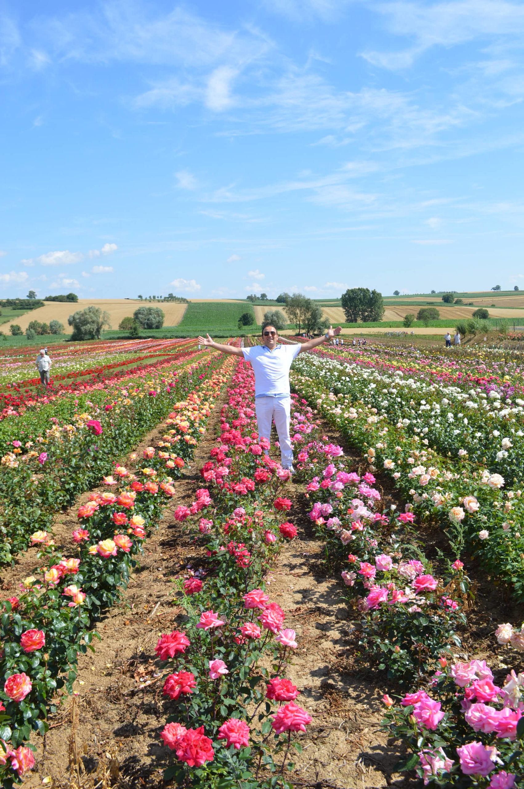 Gigi Loeffler in flowerbed (Image 6.2)